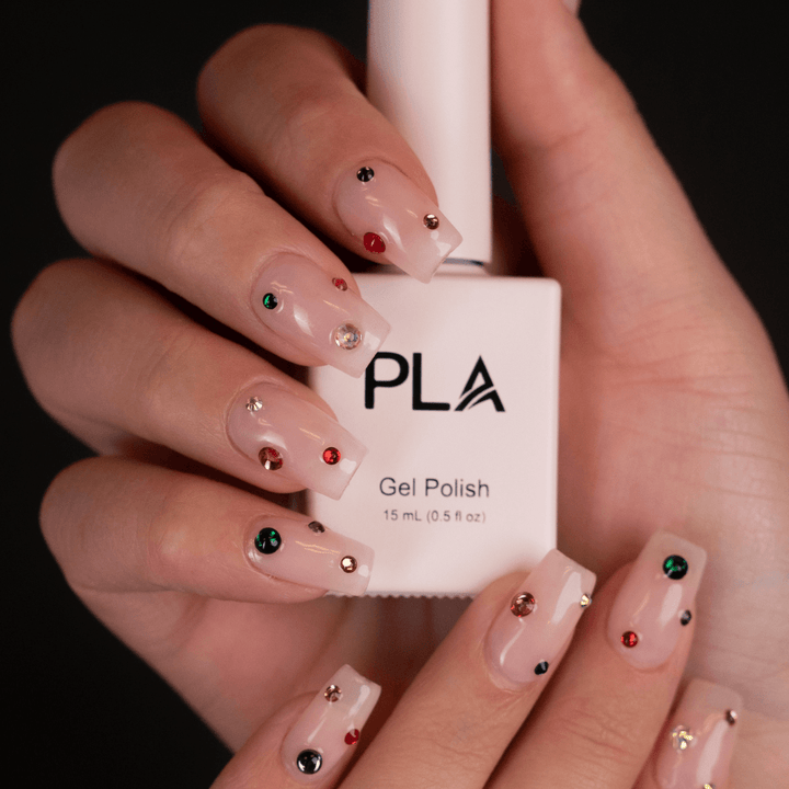 Sheer gel nail polish from PLA: Sheer Joy #202 (hands holding gel polish bottle)