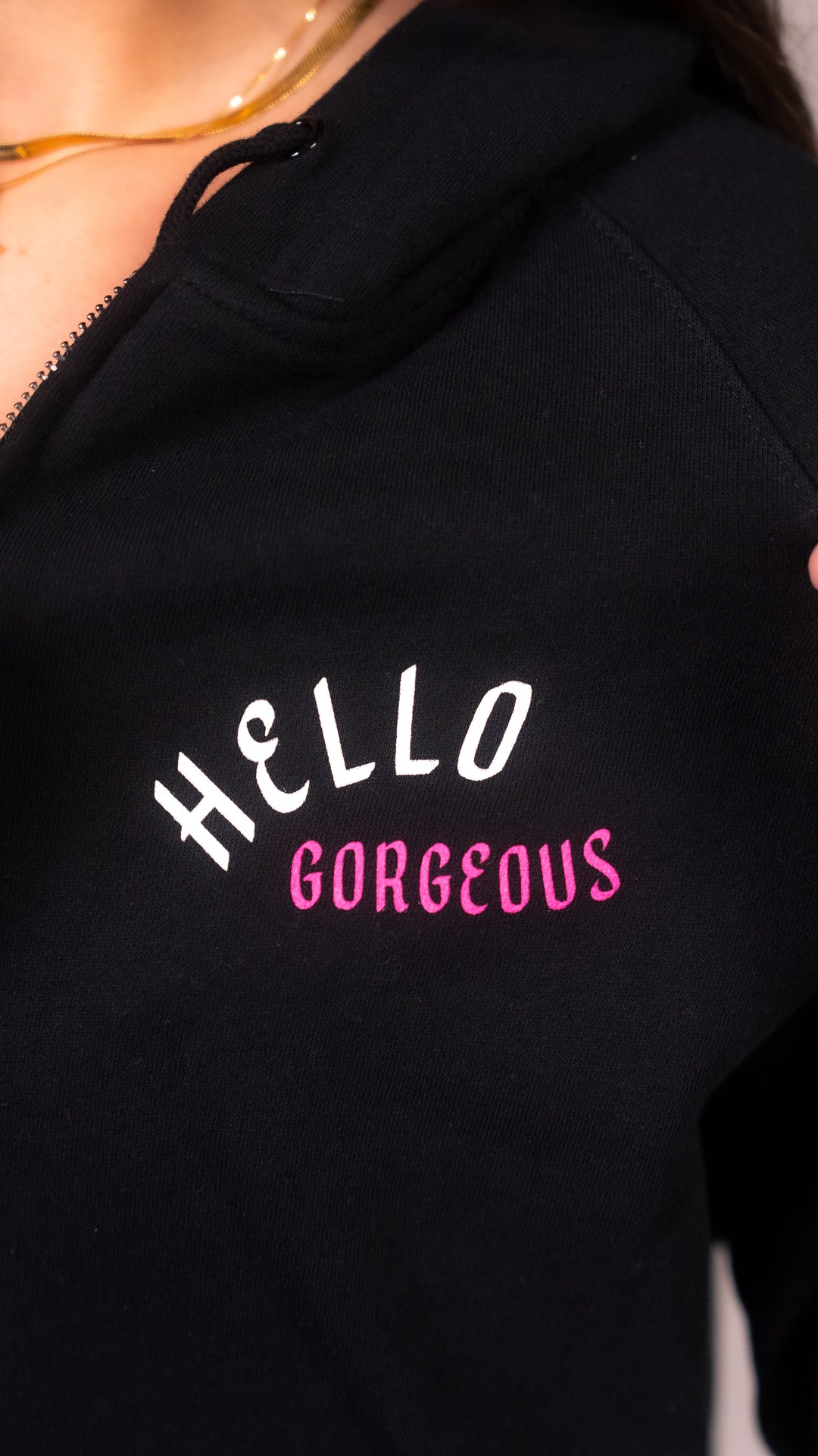 PLA Lash Sweater, Black Zip Up (close up view of the hello gorgeous design on the front of the sweater)